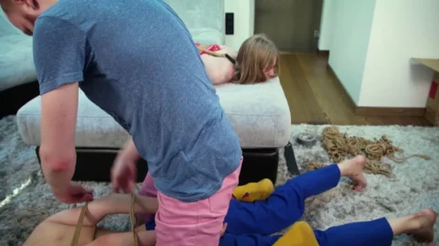 Photographers Bondage – Blonde Model in Red Fishnet Top