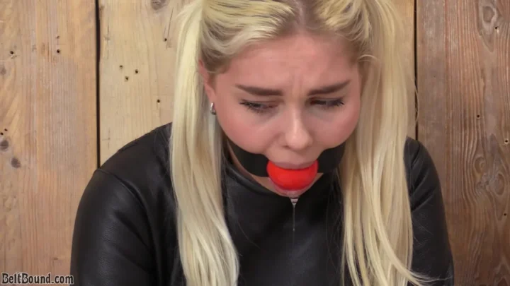 Denise – huge ballgag and black leather straitjacket