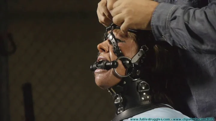 Blonde Adara Hogtied and Struggling in Leather Straps