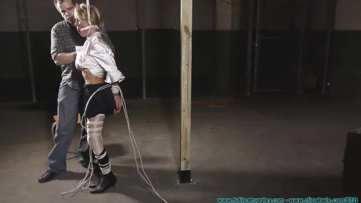 Busty Blonde Armani Knight Hogtied and Silenced in Dark Hideout