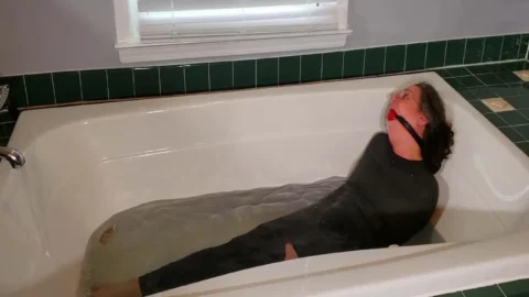 Bound in Bandages – Genevieve’s Struggle in the Bathtub