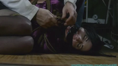 Nyxon Moans as Black Tape Tightens Her Ace Bandage Gag