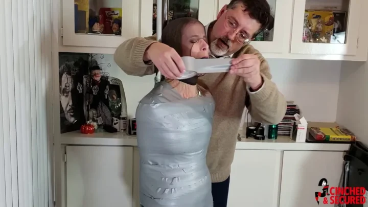 The Helpless Captive – Claire Bound in Plastic Tape and Steel with No Escape