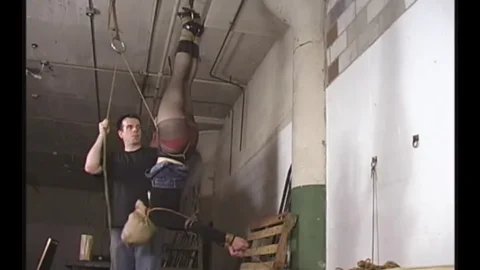 Edens Bondage Session – Hanging Upside Down in Concert Outfit