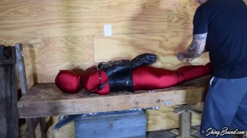 Blondes Ballgagged in Zentai Corset