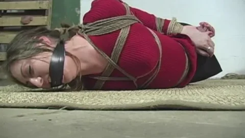 Blues Hair Tied Back in a Strict Hogtie Scene