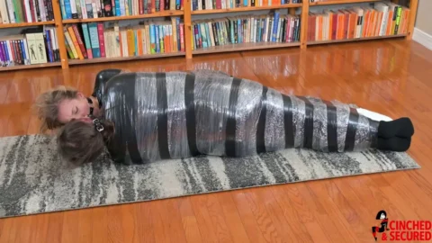 Face to Face in Constricting Captivity – A Tale of Two Tightly Wrapped Girls