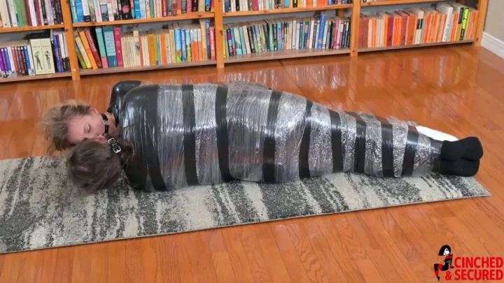 Face to Face in Constricting Captivity – A Tale of Two Tightly Wrapped Girls