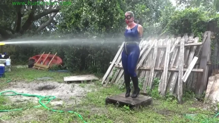 Busty Fayth on Fire Hosed Down in Blue Catsuit
