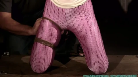 Loni Legend Spanked While Held in Rope Harness
