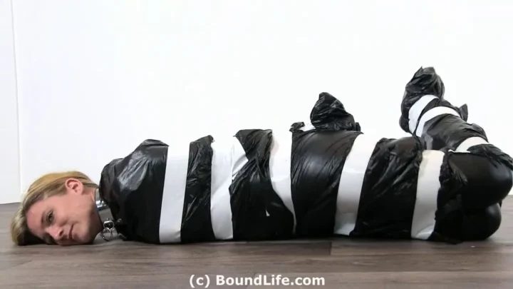 Sealed in Plastic and Tape from Shoulders to Feet