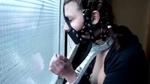 Gagged Explorer Tests Cuffs In Bare Space