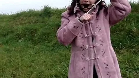 Pink Coat Brunette Forced Mouth Spreader Scene
